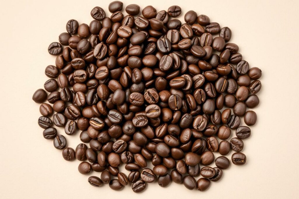 A high-quality close-up image of a mound of freshly roasted, whole coffee beans, arranged in a natural, scattered pattern against a plain, neutral background. The beans should exhibit a rich, dark brown color with a slight sheen, reflecting the care and craftsmanship of their selection and roasting. The lighting should be soft and diffused, highlighting the textural details and the natural variations in the beans' shapes and sizes. The overall composition should convey a sense of artisanal quality, inviting the viewer to explore and appreciate the raw materials that go into crafting the perfect cup of coffee or espresso.
